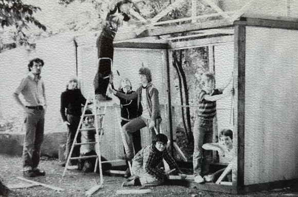 Mr. O'Neill and students building a playground shed.